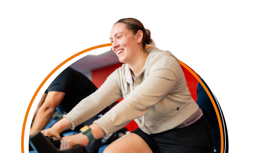 Landing page image woman riding spin bike